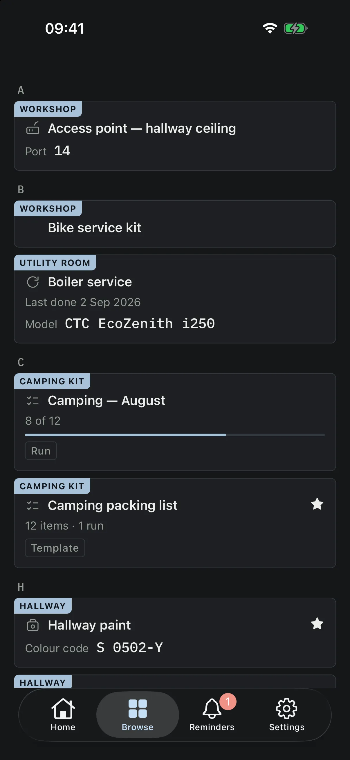 The browse screen listing everything in one alphabetical list, each row naming which room or collection it belongs to — an access point in the Workshop, the boiler service in the Utility room, a camping run in Camping kit, the hallway paint in the Hallway.